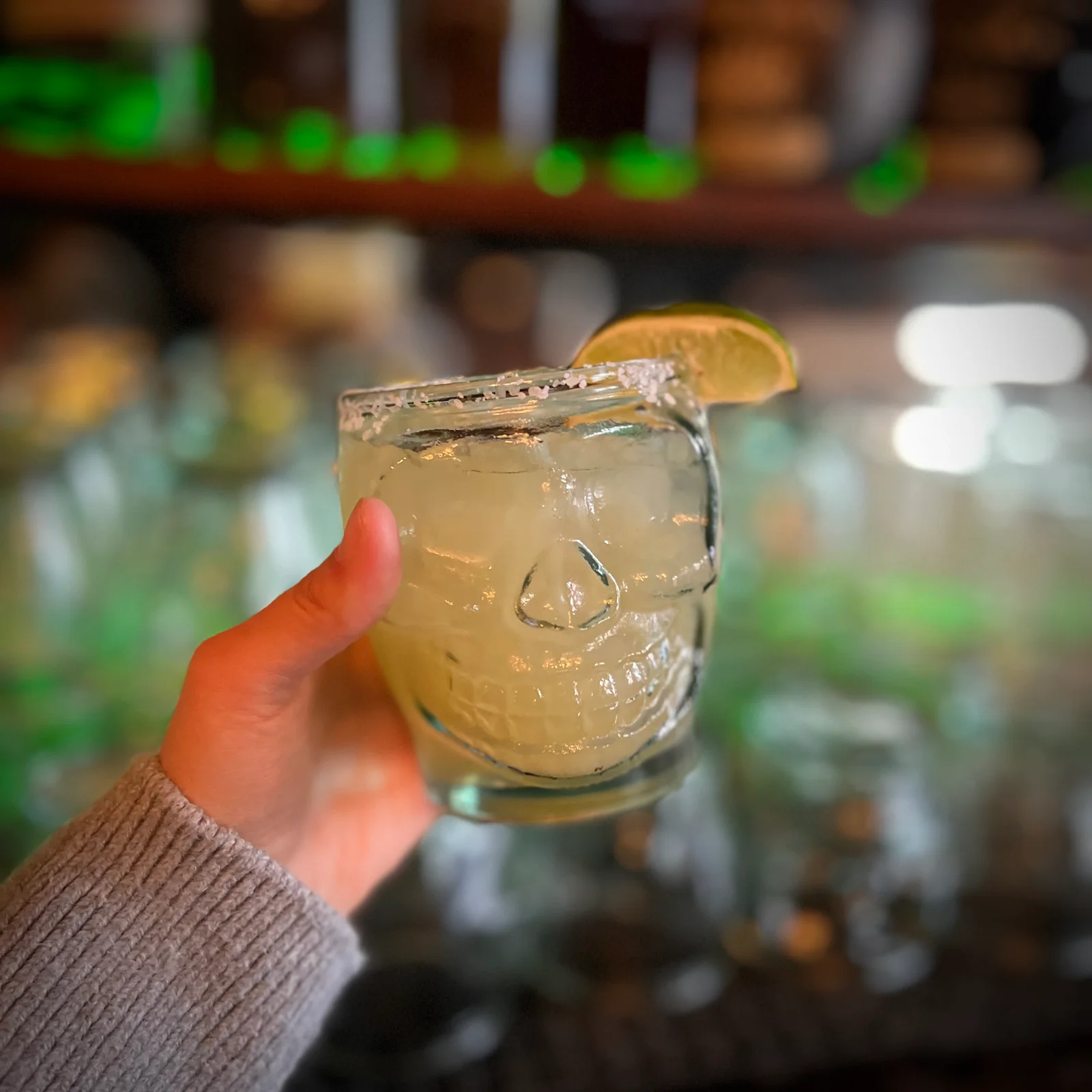 House margarita with a lime garnish in a skull-shaped glass at La Dama.